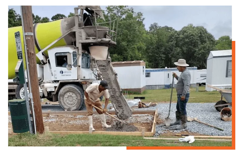 Two concrete workers working
